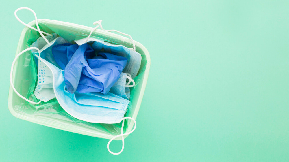 birdseye view of medical masks in a bin