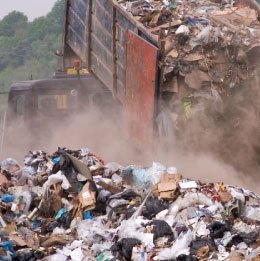 Ace Waste vehicle unloading waste at a landfill showcasing effective waste management solutions.